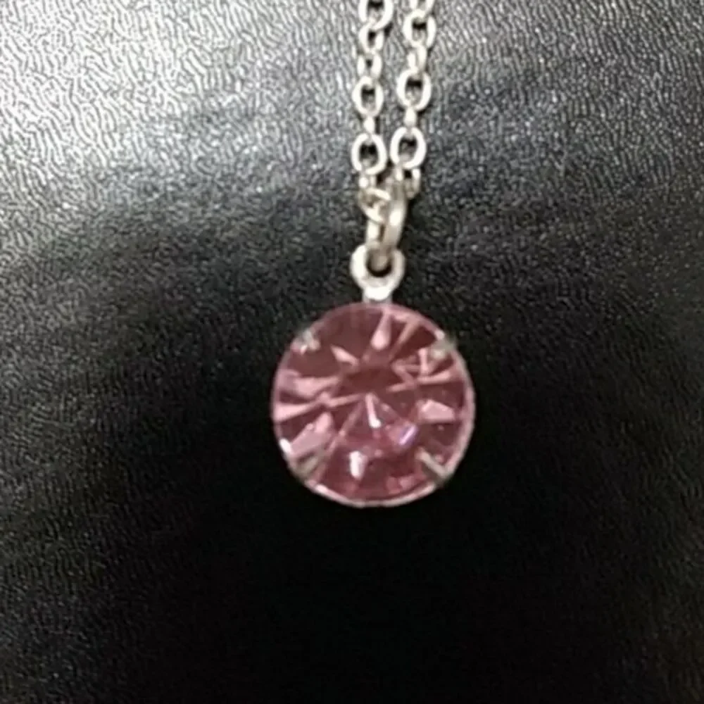 Silver tone and pink stone necklace